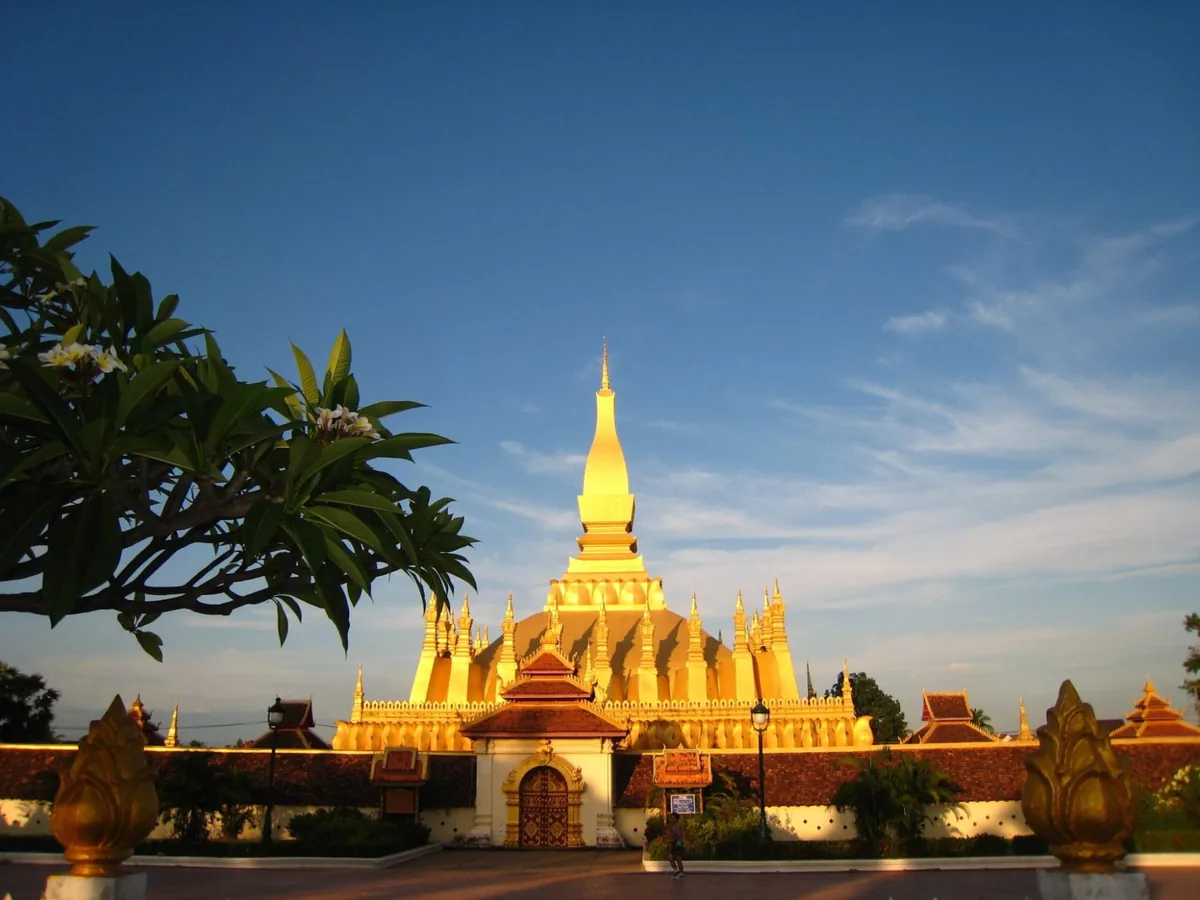 The golden stupa of Pha That Luang in Vientiane, Laos, at sunset
