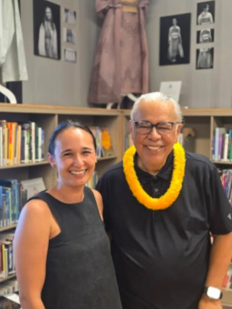 Two guests, one in a yellow lei, at the Molokaʻi Public Library remembrance